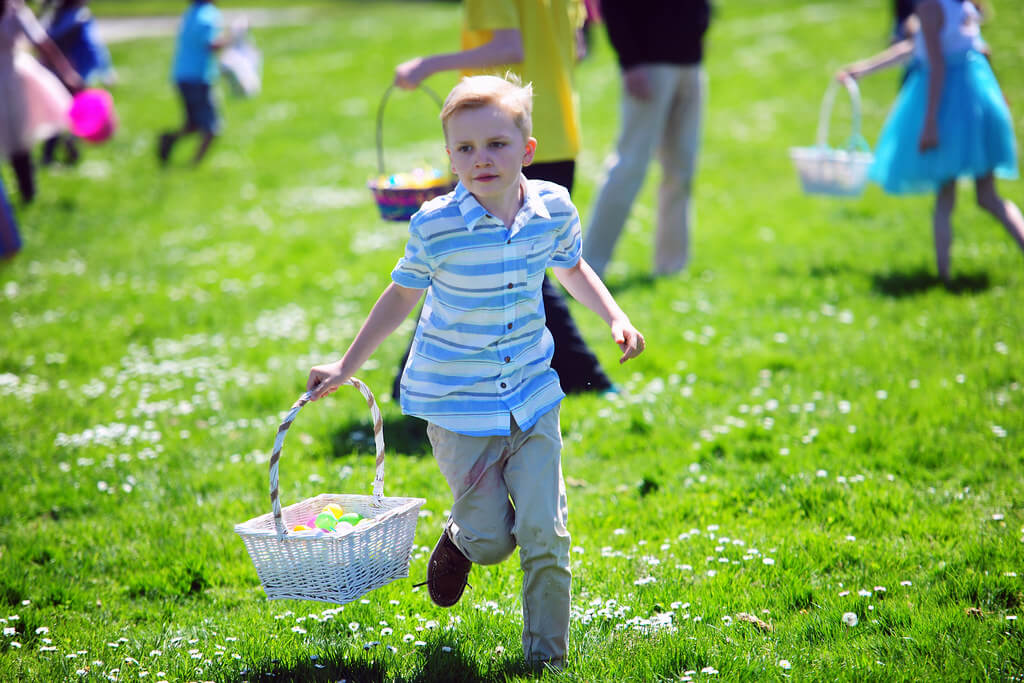 kid running with Easter egg basket